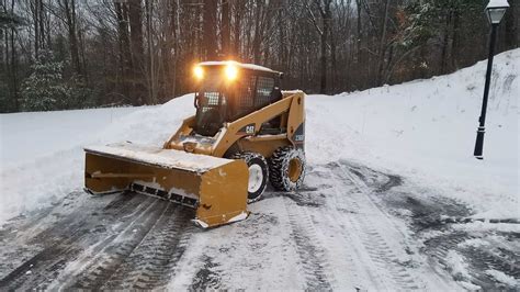 plowing snow with track skid steer vs tire skid steer|tracked skid steer pros and cons.